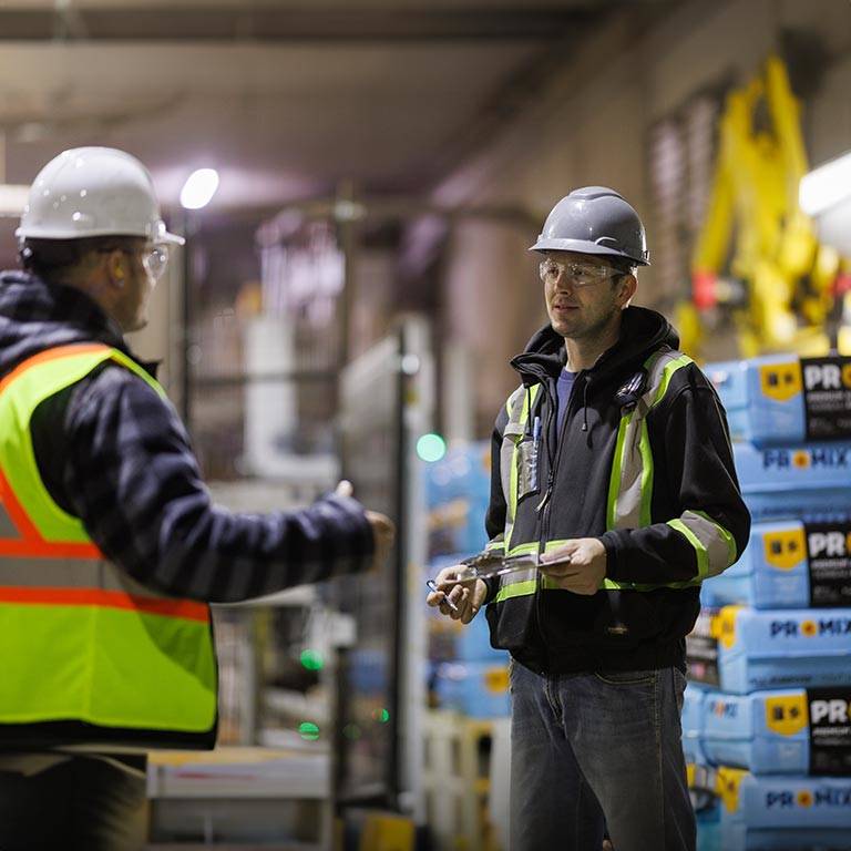 Two team members talking